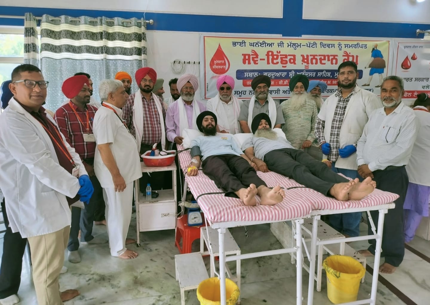 Father and son donated blood together in the blood donation camp of village Mubarakpur dedicated to Bhai Ghanhaiya's Malam Patti Day.